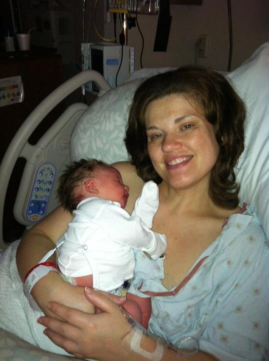 Holding Nathaniel 3 hours after birth. He had nursed for the first time.