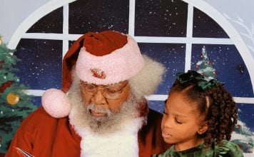 New Orleans Mom Little girl with santa claus chocolate Santa