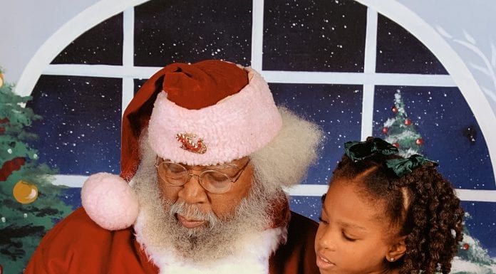 New Orleans Mom Little girl with santa claus chocolate Santa