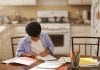 black student learning at home