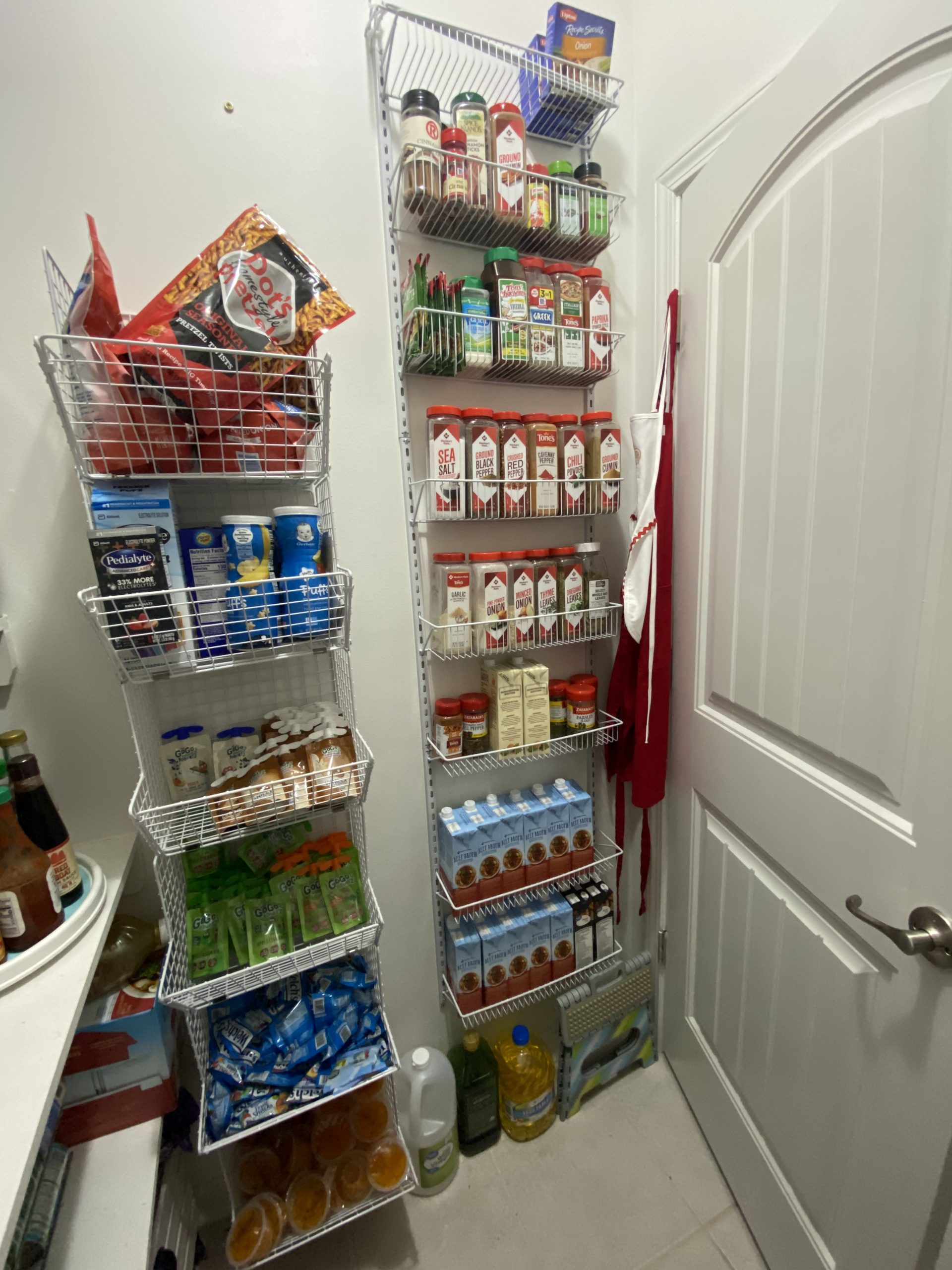 hang storage bins on wall space to organize your pantry