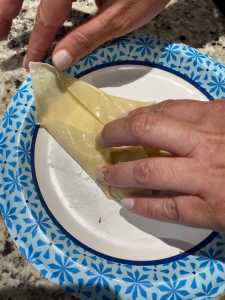 Moisten the eggroll wrapper to seal Boudin Eggroll