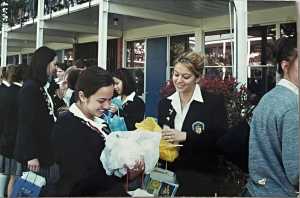 Senior & Junior sisters exchanging gifts in the courtyard.