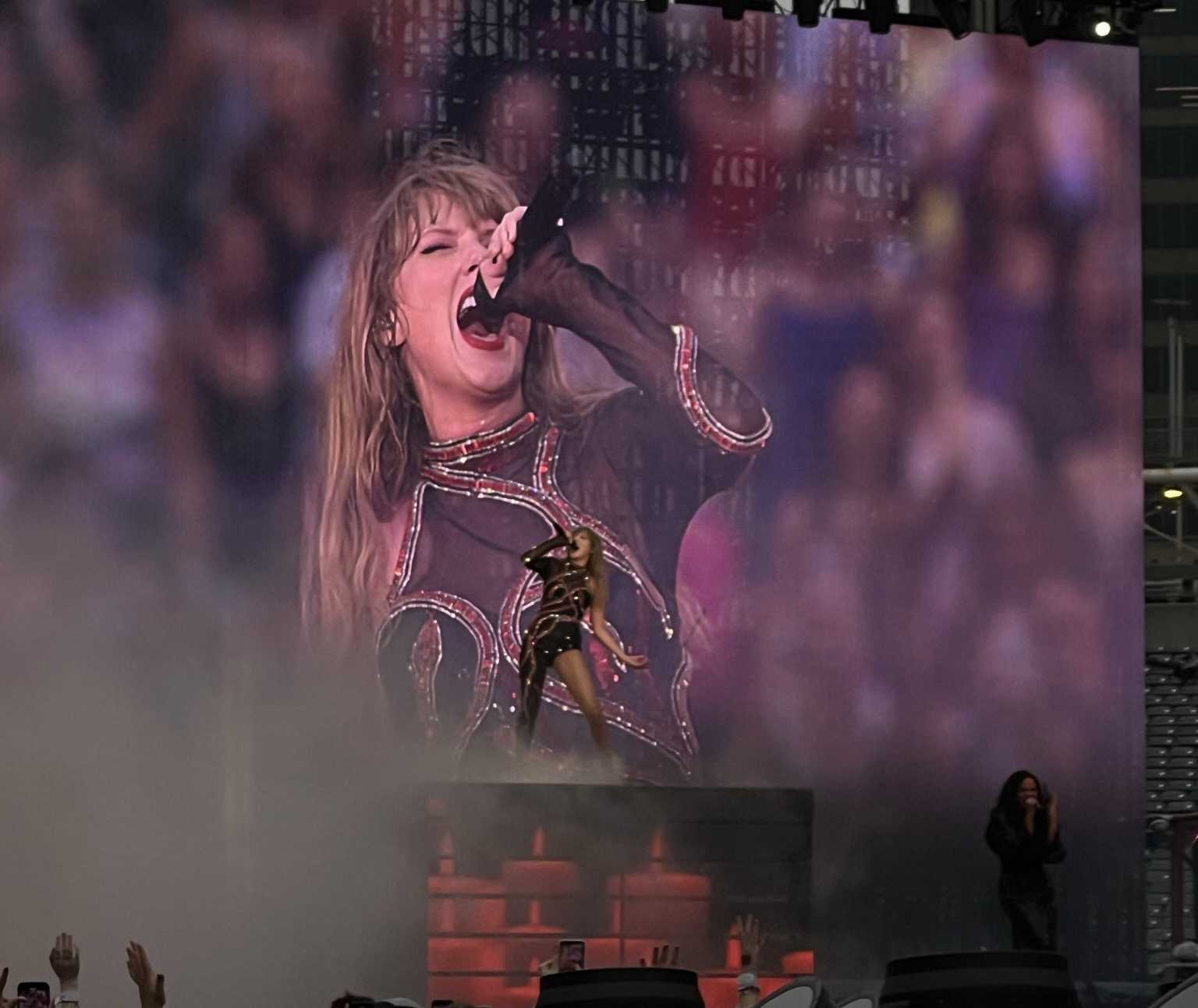 Taylor Swift on stage singing.